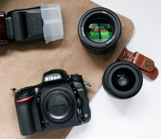 Camera gear laid out on camera bag